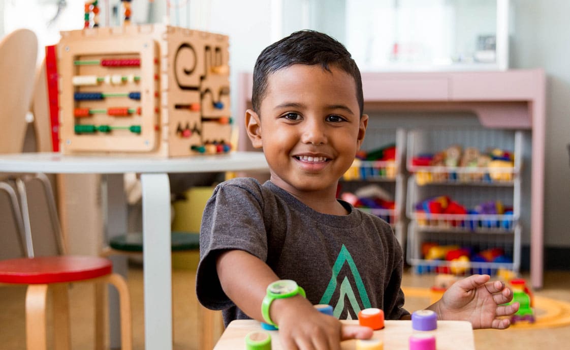 boy plays in pediatric waiting room