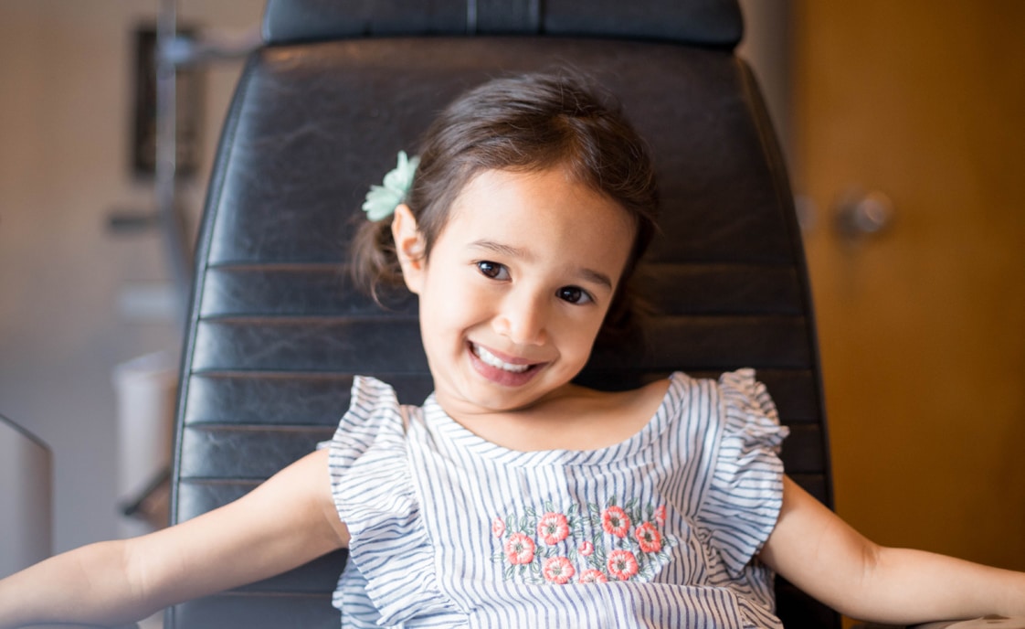 Young girl in eye exam chair