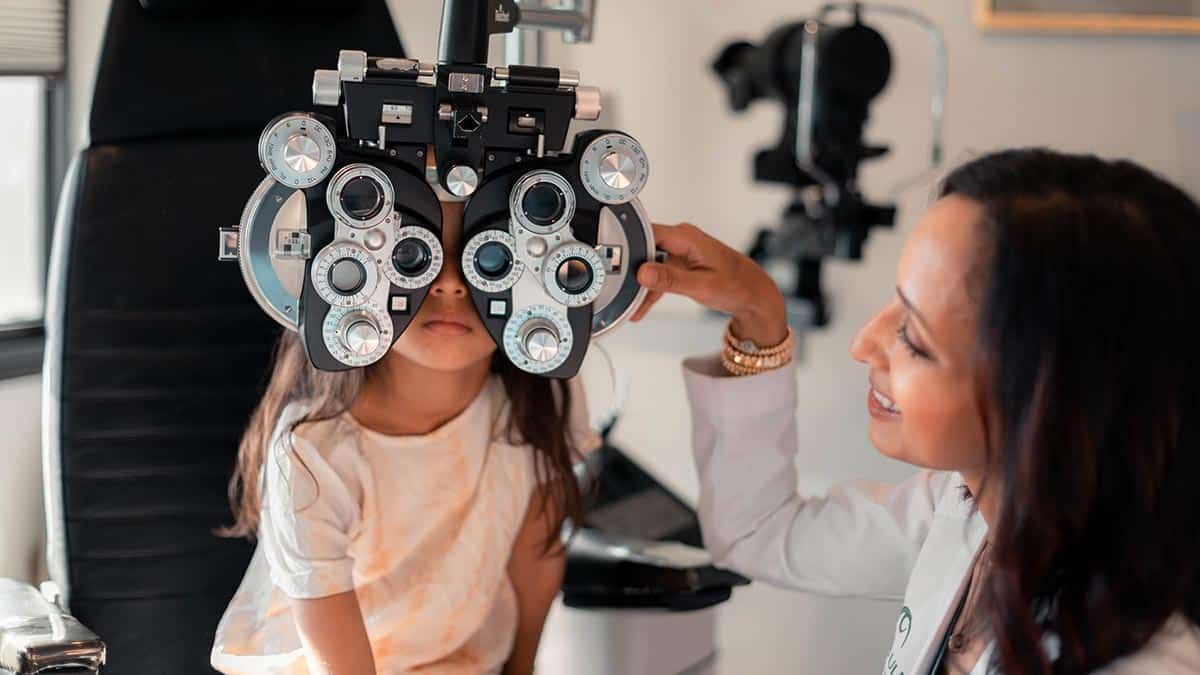 Eye doctor, Dr. Rupa Wong examines a young child to start low dose atropine drops